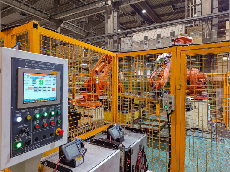 Pressing line automation with robotic arms and control panel by ASA-Projekt