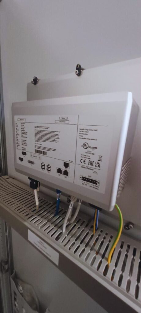 Controller module installed in control cabinet, part of industrial power plant control system with Ethernet and power connections